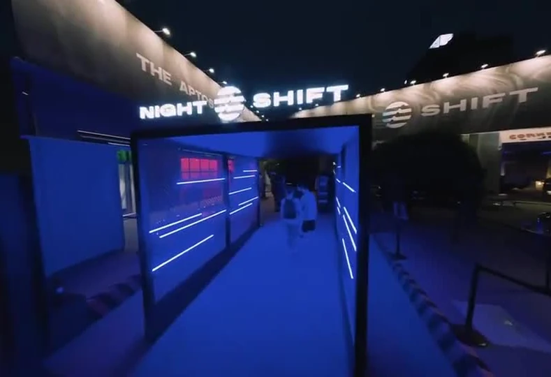 Aptos, Venue entrance; frame from the archived IUM project film. Source: https://iumlabs-web.vercel.app/media/home-video/aptos.mp4