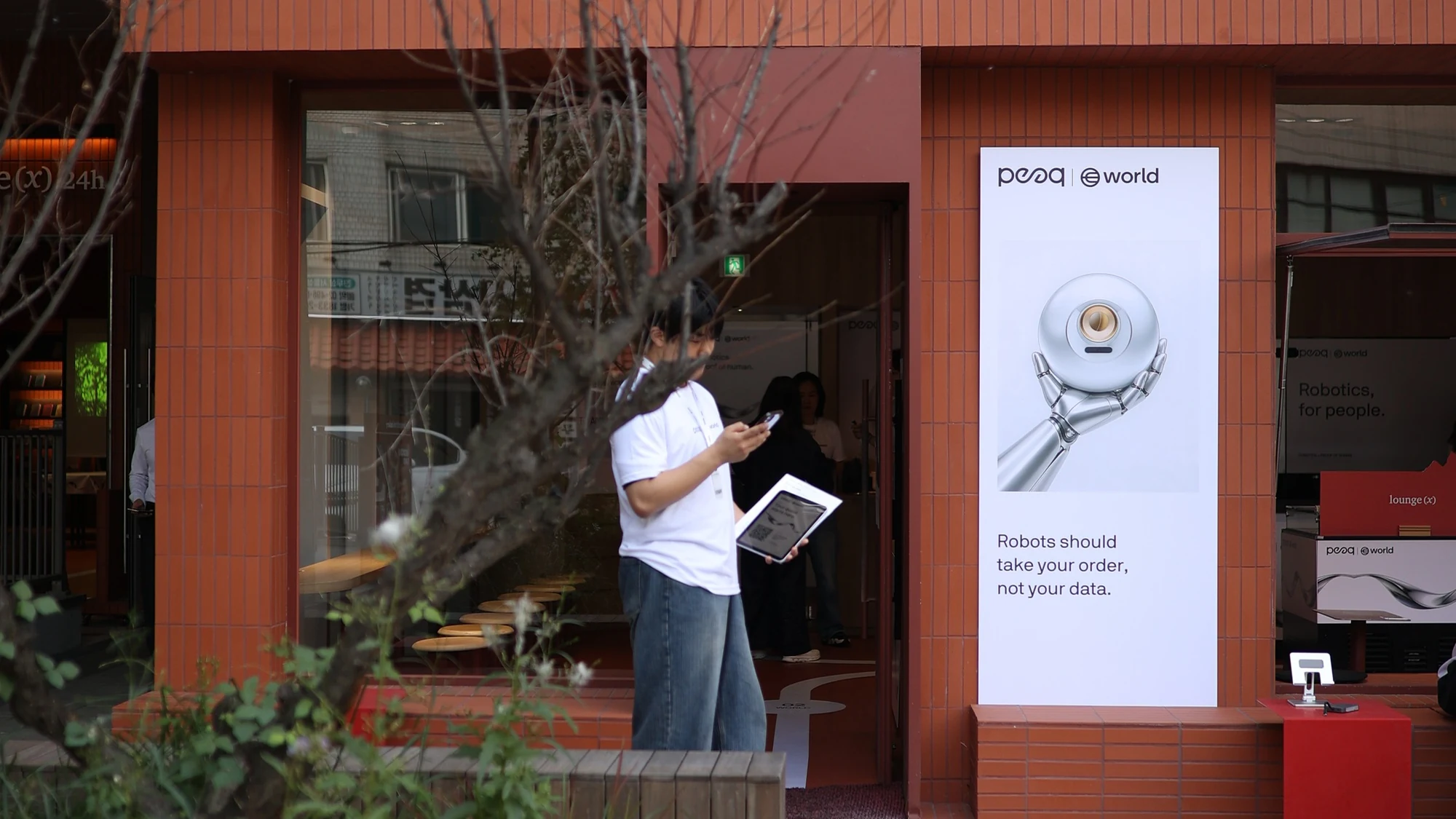 World × peaq — Exterior facade and co-branded entrance, KBW 2026