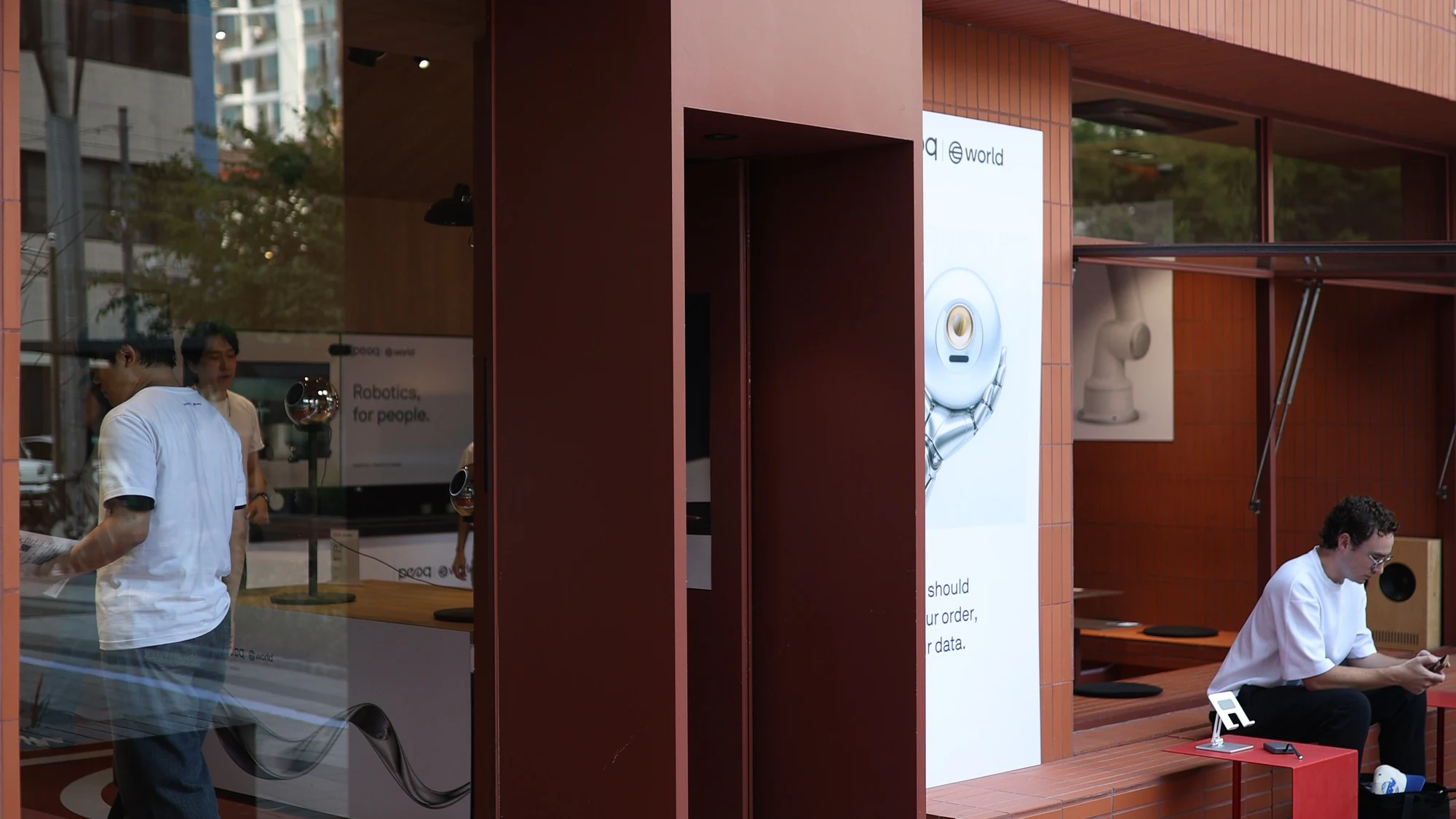 World × peaq — Venue frontage and joint branding, KBW 2026