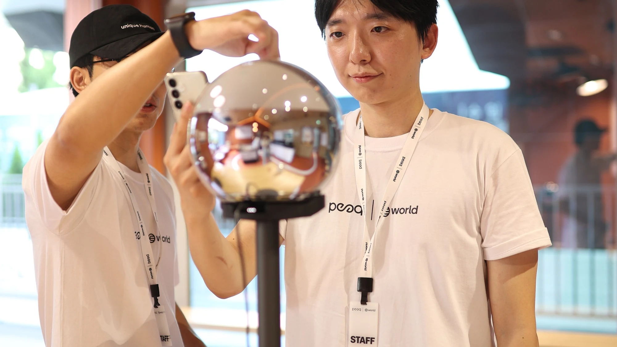 World × peaq — Participant trying a World Orb with assistance, KBW 2026