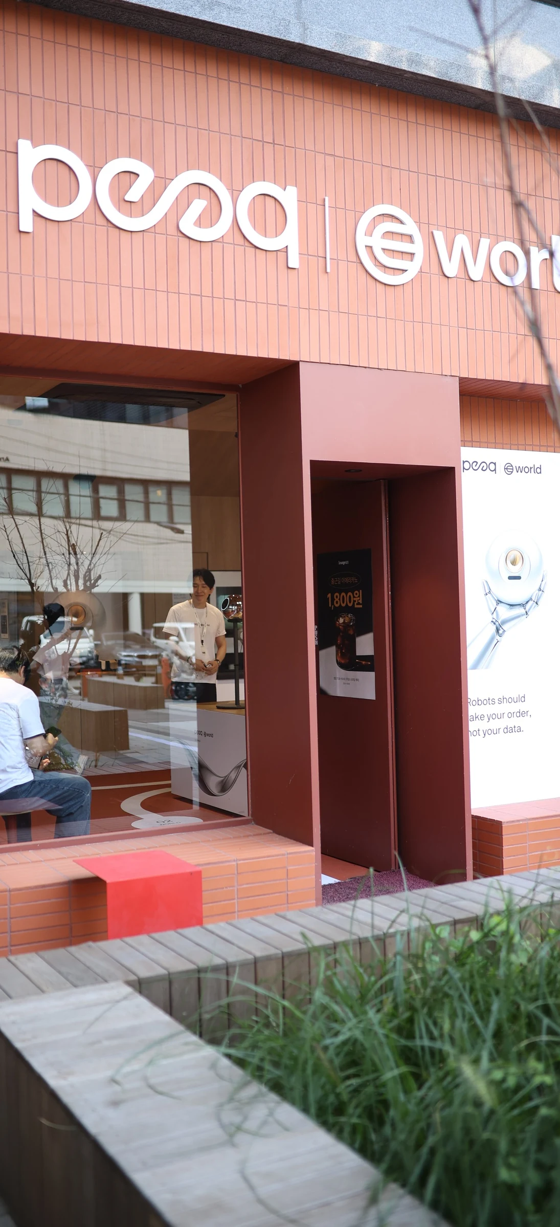 World × peaq — Venue frontage viewed through the window, KBW 2026