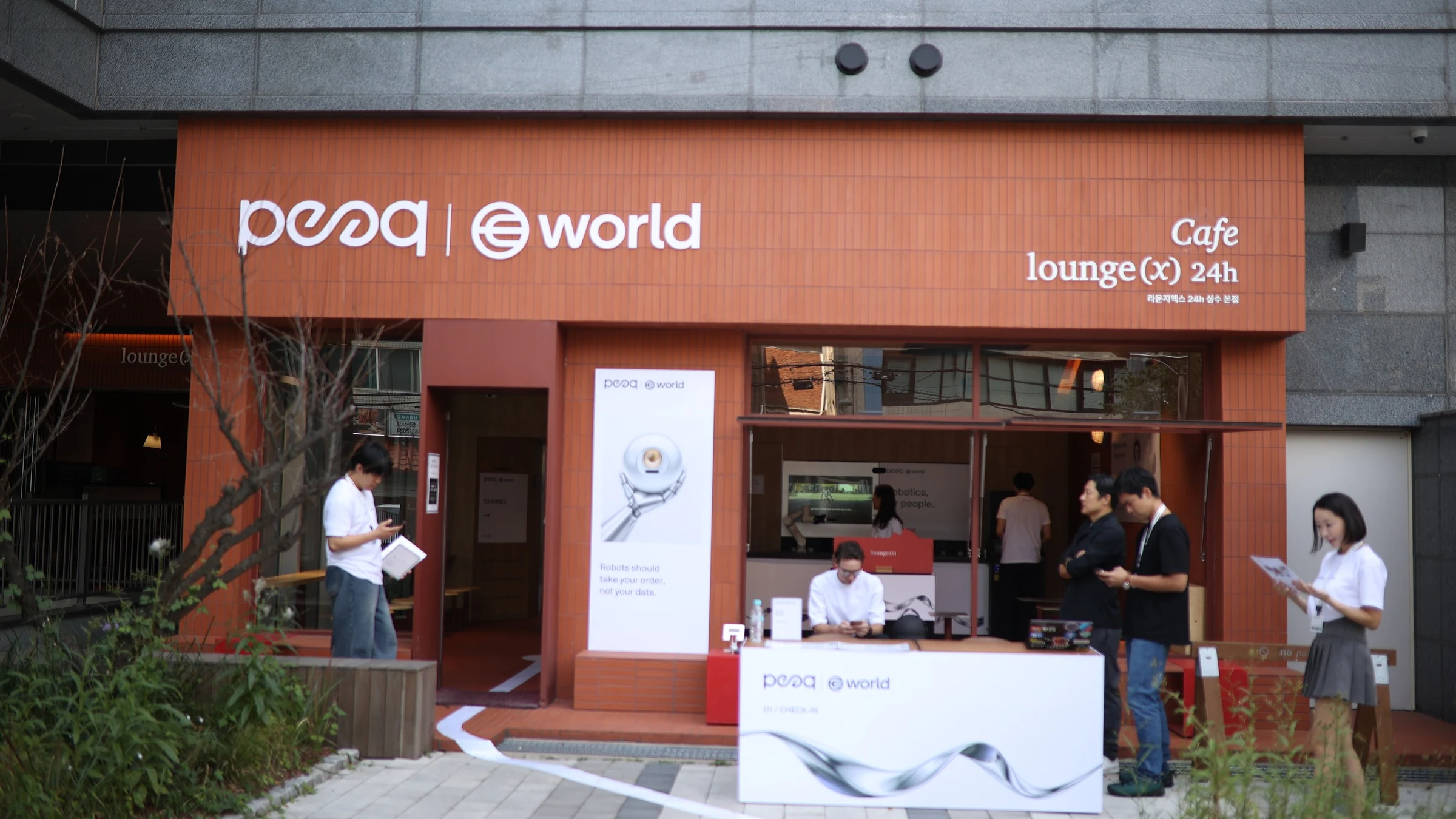 World × peaq — Venue facade with peaq and World signs, KBW 2026